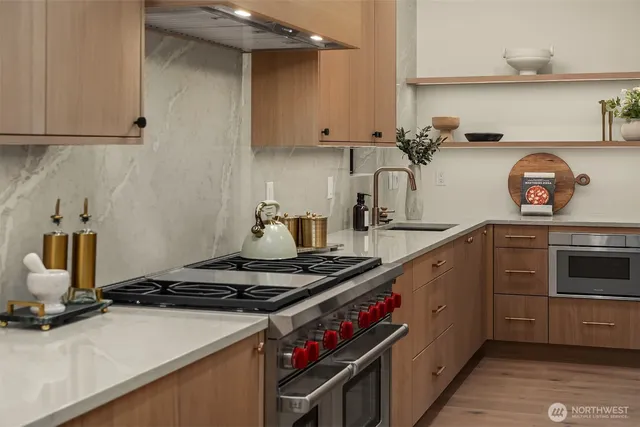 a kitchen with a sink a counter and a refrigerator