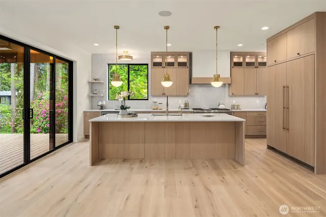 a living room with furniture and kitchen view