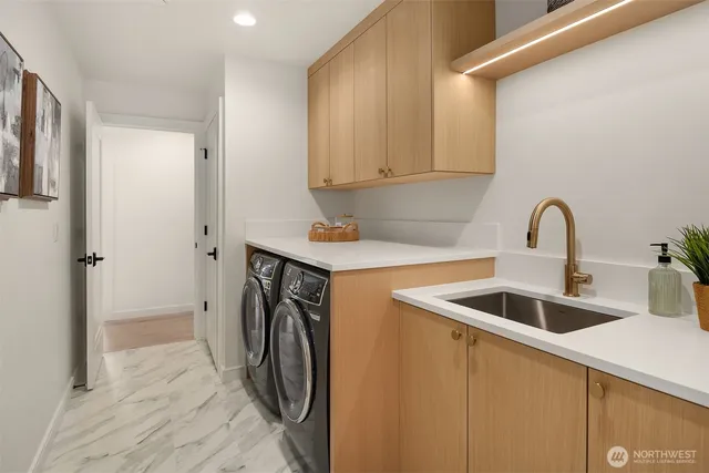 a spacious bedroom with a bed and large window