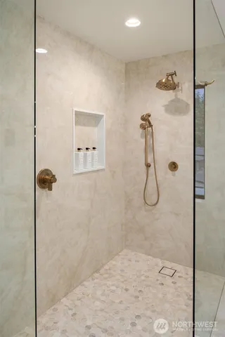 a spacious bedroom with a bed and a cabinets