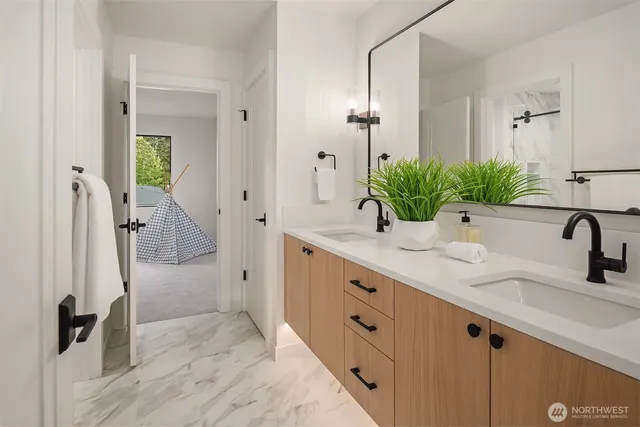 a bedroom with a bed and a view of bathroom