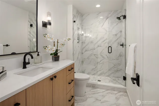 a living room with stainless steel appliances kitchen island granite countertop furniture a rug and white kitchen