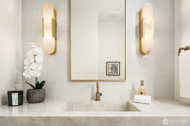 a bathroom with a tub and a mirror