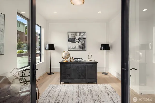 a kitchen with stainless steel appliances granite countertop a sink a stove and a refrigerator