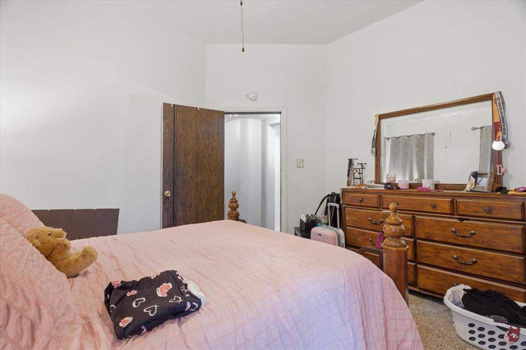 15 Division Street Pittsburgh, PA 15205 - Photo 14 of 44 a bedroom with a bed and a dresser