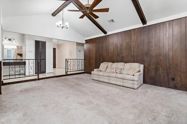 a view of kitchen with cabinets and window