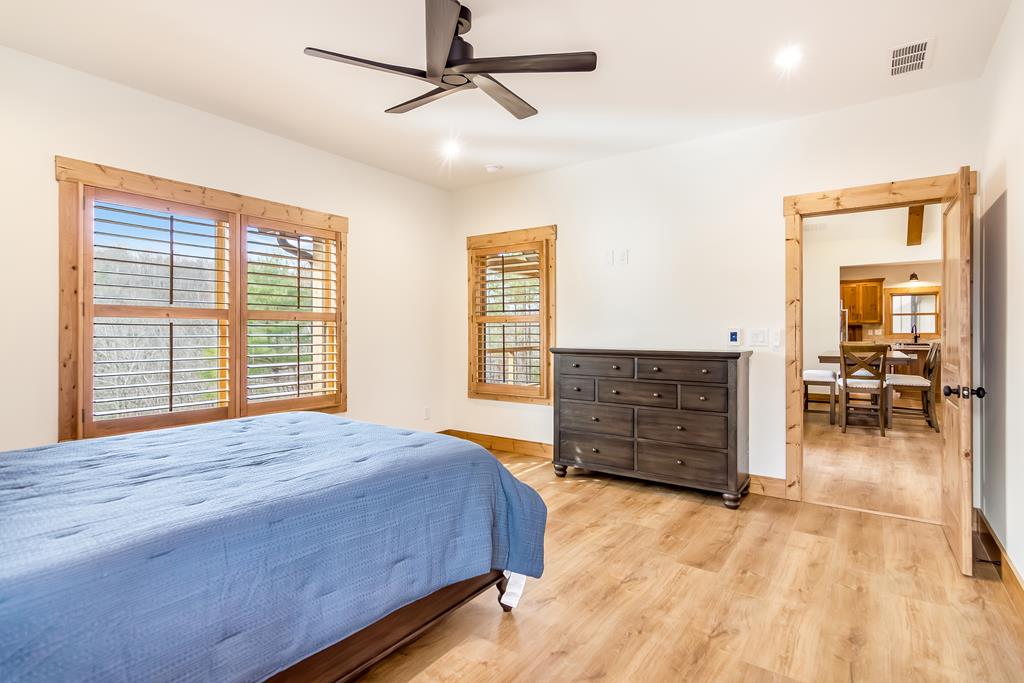 2468 Twisted Oak Road Talking Rock, GA 30175 - Photo 18 of 67 a bedroom with a bed and a dresser