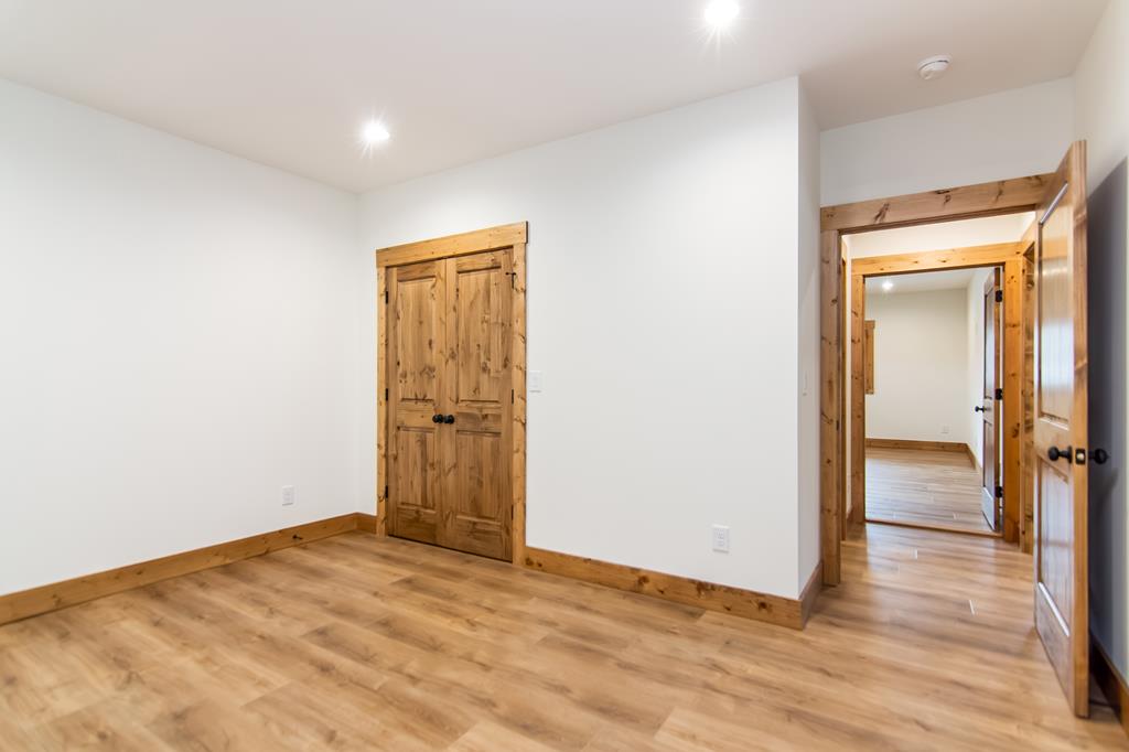2468 Twisted Oak Road Talking Rock, GA 30175 - Photo 36 of 67 an empty room with wooden floor and closet