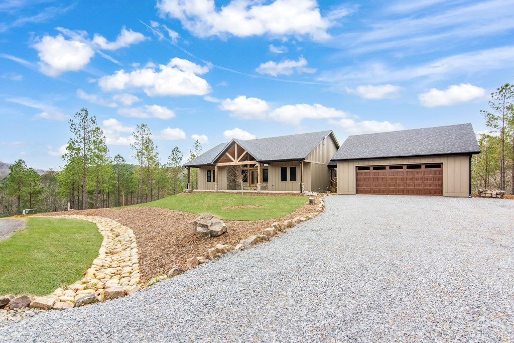 2468 Twisted Oak Road Talking Rock, GA 30175 - Photo 4 of 67 a front view of a house with a yard and garage