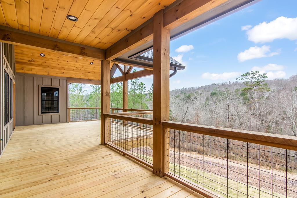 2468 Twisted Oak Road Talking Rock, GA 30175 - Photo 44 of 67 a view of porch with a floor to ceiling window next to a yard
