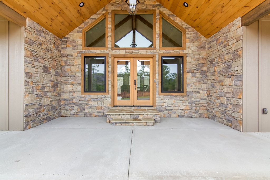 2468 Twisted Oak Road Talking Rock, GA 30175 - Photo 6 of 67 a view of a brick house with windows