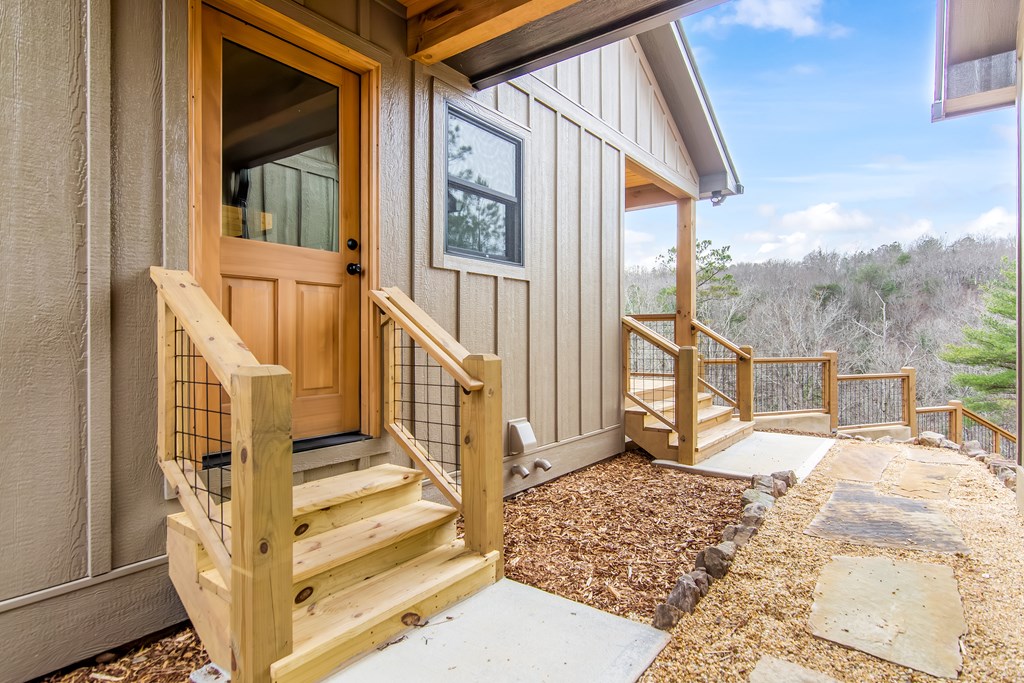 2468 Twisted Oak Road Talking Rock, GA 30175 - Photo 7 of 67 a view of a house with wooden floor and wooden fence