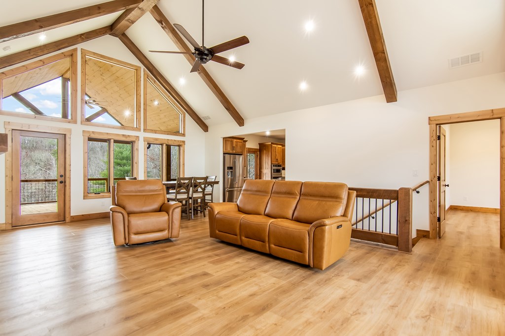 2468 Twisted Oak Road Talking Rock, GA 30175 - Photo 10 of 67 a living room with furniture and a wooden floor