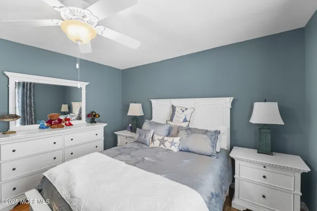 a bed room with a bed and a chandelier