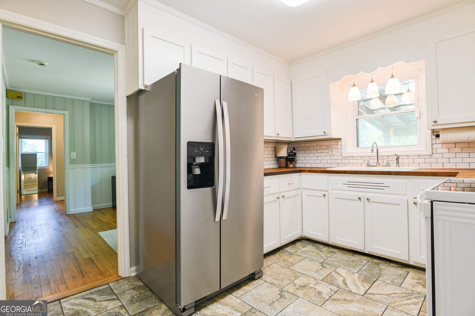 545 Forest Hill Road Macon, GA 31210 - Photo 32 of 63 a kitchen with stainless steel appliances granite countertop a refrigerator and a stove