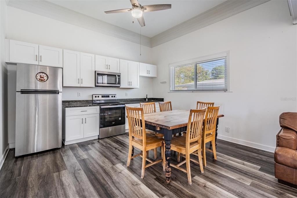 2319 West Aileen Street Tampa, FL 33607 - Photo 15 of 26 a view of kitchen with cabinets table and chairs