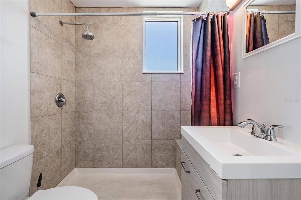 2319 West Aileen Street Tampa, FL 33607 - Photo 22 of 26 a bathroom with a sink and a shower