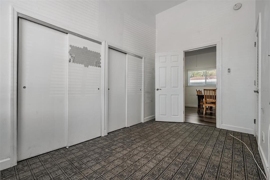 2319 West Aileen Street Tampa, FL 33607 - Photo 25 of 26 a view of a room with wooden floor and a bathroom