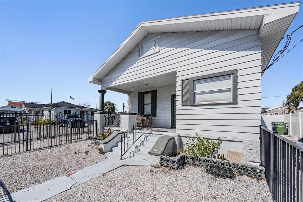 2319 West Aileen Street Tampa, FL 33607 - Photo 3 of 26 a view of a house with backyard and porch