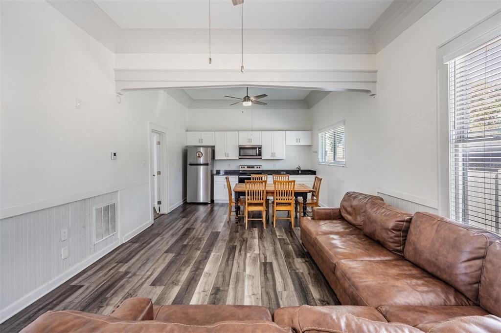 2319 West Aileen Street Tampa, FL 33607 - Photo 7 of 26 a living room with furniture and a wooden floor