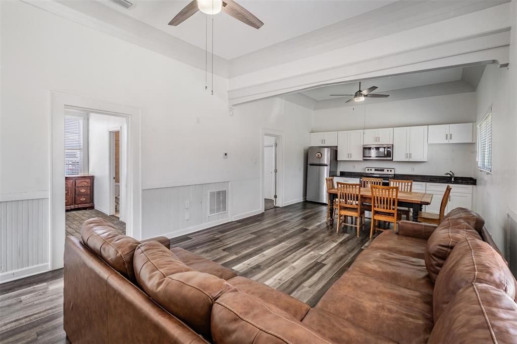 2319 West Aileen Street Tampa, FL 33607 - Photo 8 of 26 a living room with furniture and a dining table