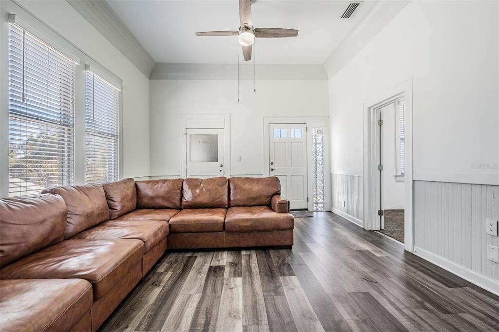 2319 West Aileen Street Tampa, FL 33607 - Photo 9 of 26 a living room with furniture and a wooden floor