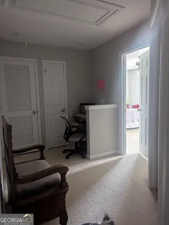 a living room with furniture and a gate