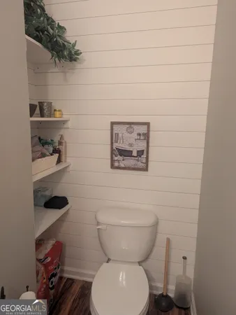 a bathroom with a toilet and a sink