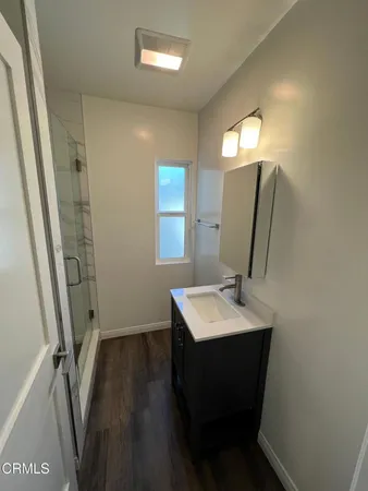 a bathroom with a sink a mirror and a toilet