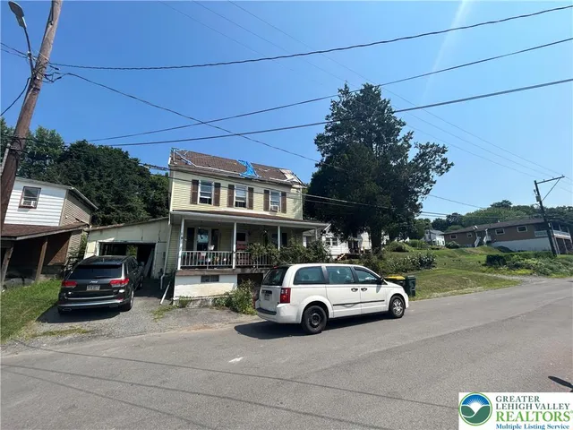 a car parked in front of a house