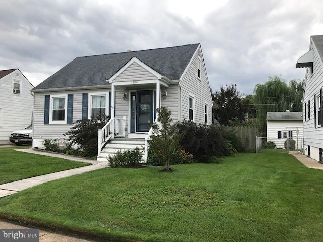 1704 Leslie Road Baltimore, MD 21222 - Photo 1 of 24 a front view of a house with a garden