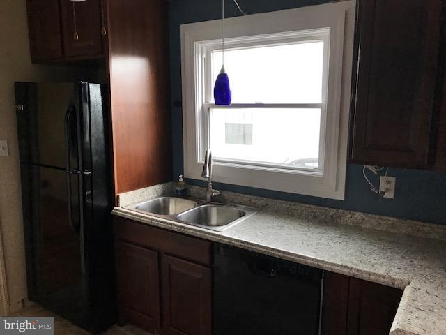 1704 Leslie Road Baltimore, MD 21222 - Photo 13 of 24 a kitchen with a sink and a window