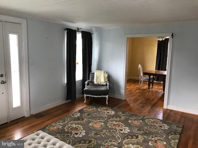 1704 Leslie Road Baltimore, MD 21222 - Photo 15 of 24 a living room with furniture rug and a window