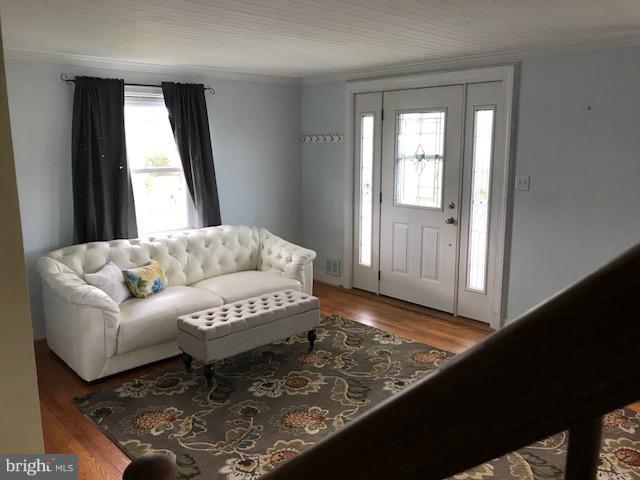 1704 Leslie Road Baltimore, MD 21222 - Photo 17 of 24 a living room with furniture and a window