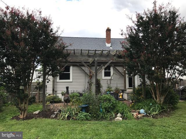 1704 Leslie Road Baltimore, MD 21222 - Photo 18 of 24 a front view of a house with a garden