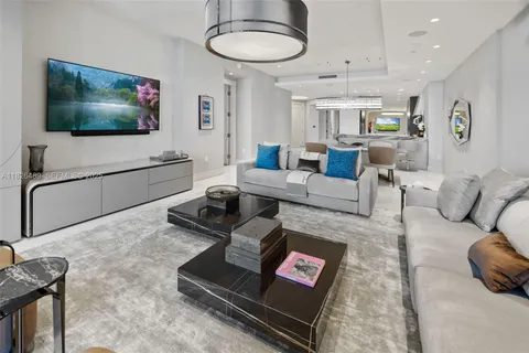 a kitchen with stainless steel appliances kitchen island granite countertop a refrigerator and microwave