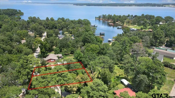 an aerial view of multiple house with yard