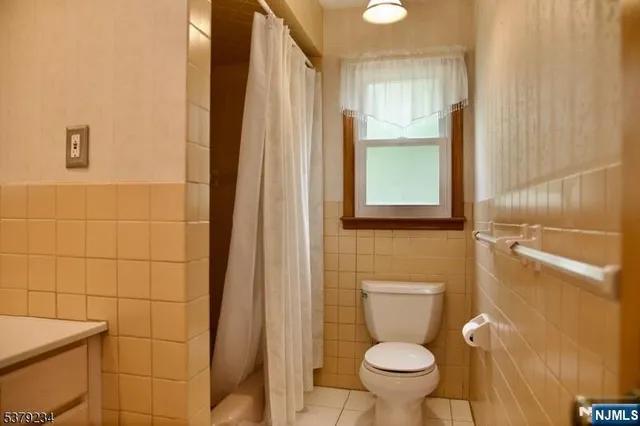 a bathroom with a toilet and a sink