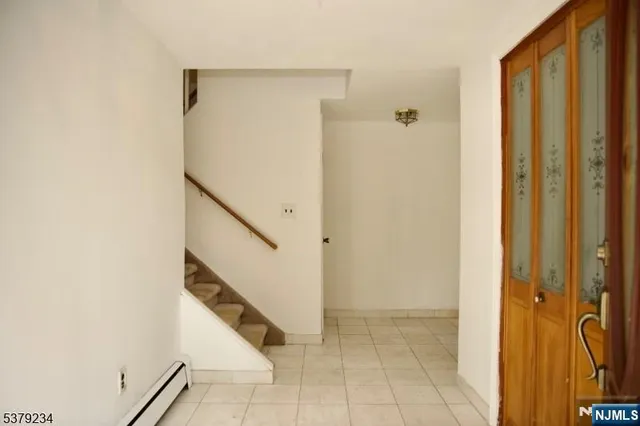 a view of entryway with stairs