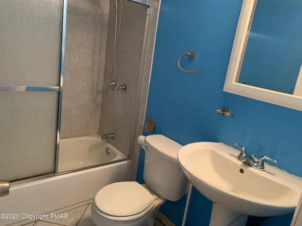 a view of a tree in the middle of a yard