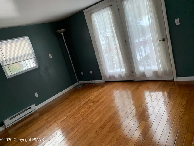 a view of a tree in the middle of a yard