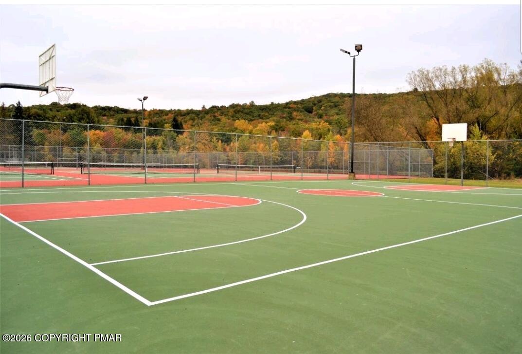 124 Saunders Drive Bushkill, PA 18324 - Photo 23 of 43 a view of an outdoor space and tennis court