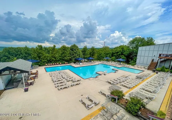 a view of outdoor space swimming pool and outdoor seating