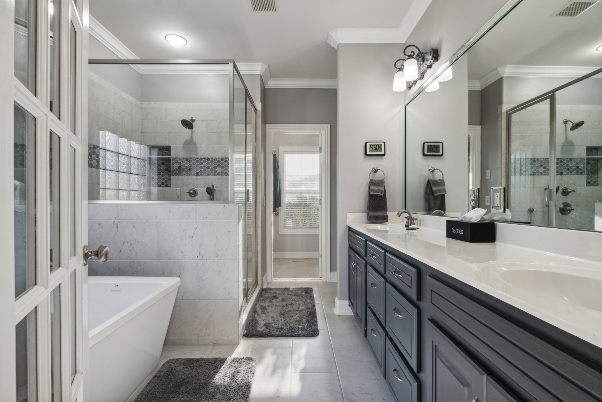 1014 Rhett Place Lebanon, TN 37087 - Photo 13 of 26 AMAZING updated primary suite. with his and her closets, double vanity, soaking tub and oversized walk in shower.