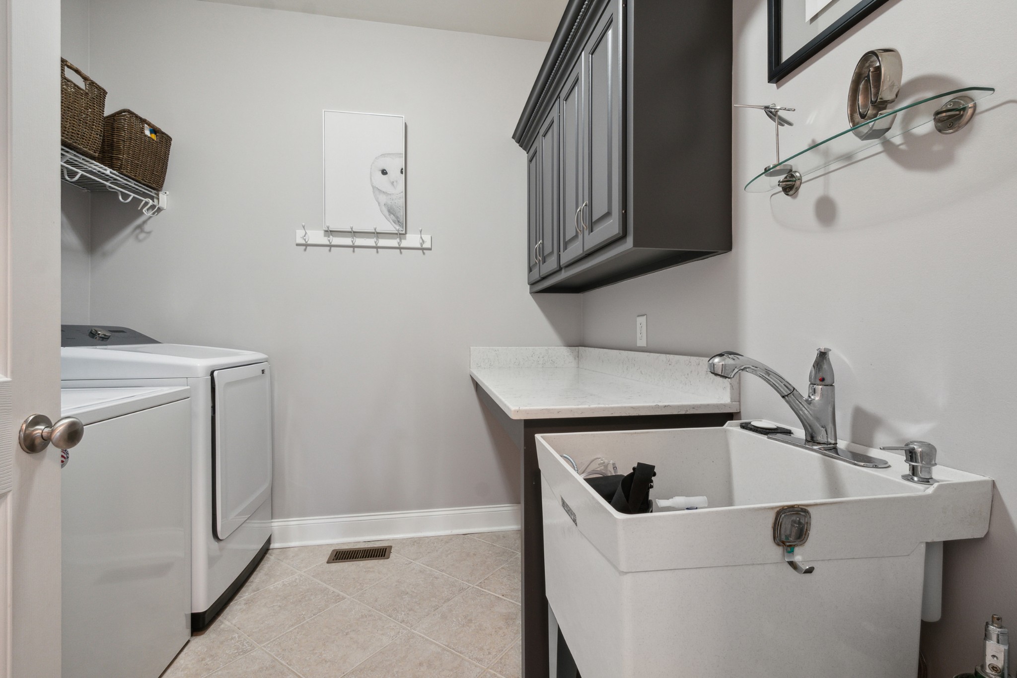 1014 Rhett Place Lebanon, TN 37087 - Photo 18 of 26 Large utility room with soaking sink, cabinet space and counter top.
