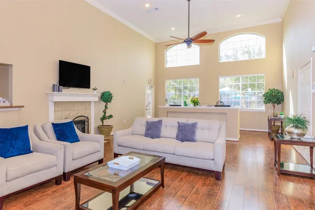 a living room with fireplace furniture and a flat screen tv