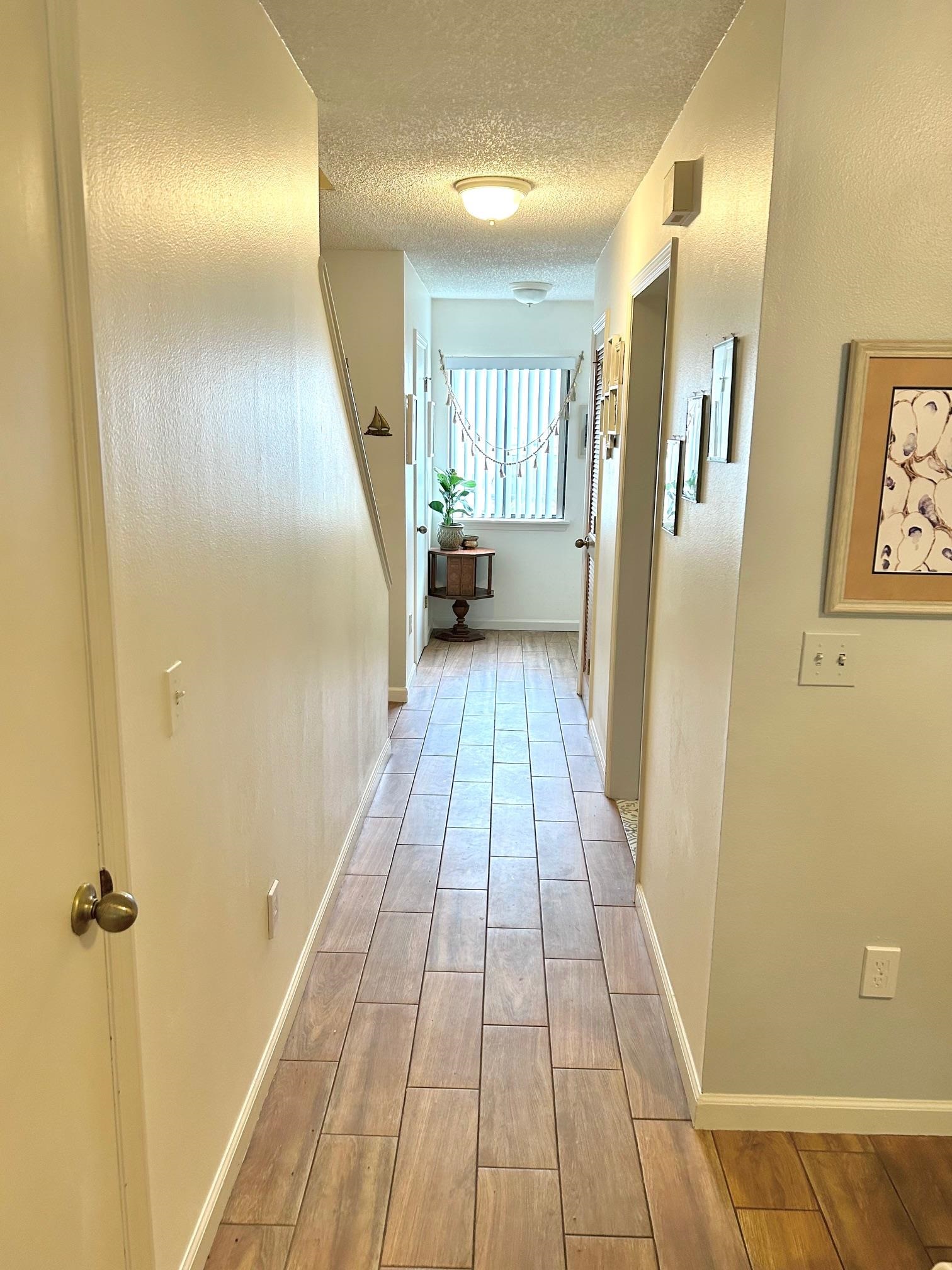 4 Moultrie Creek Circle St. Augustine, FL 32086 - Photo 33 of 55 a view of a hallway with wooden floor