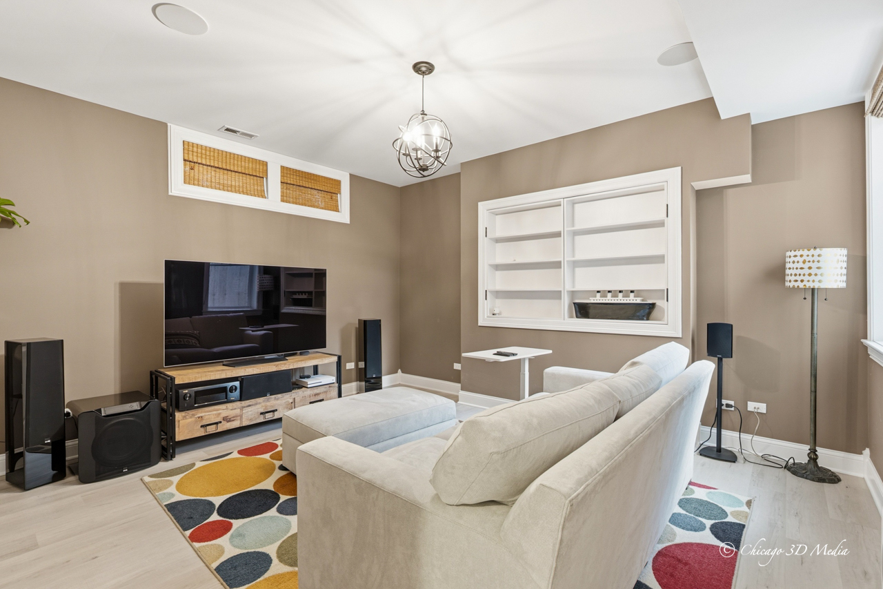 306 17th Street Wilmette, IL 60091 - Photo 36 of 48 a living room with furniture and a flat screen tv