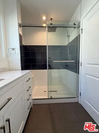a bathroom with a tub and a shower
