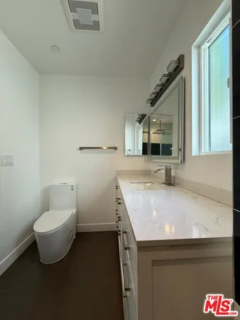 a bathroom with a sink and mirror